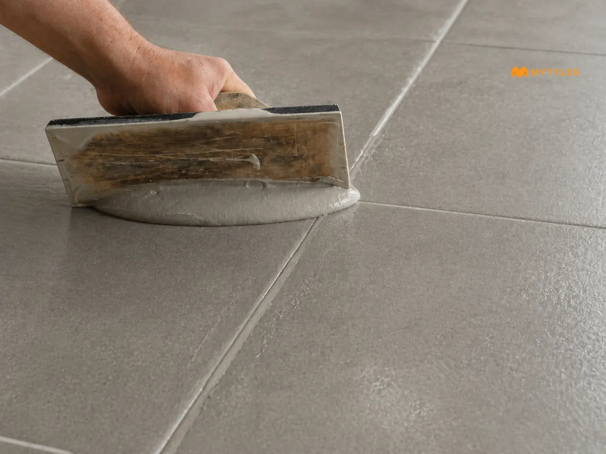 Grout Application on Grey Tiles